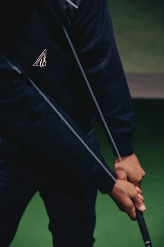 ゴルフスイングの腕と身体の同調感を自然に身につけるための練習器具「東家チューブ」